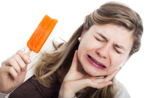 woman suffering from sensitive teeth