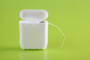 dental floss on green