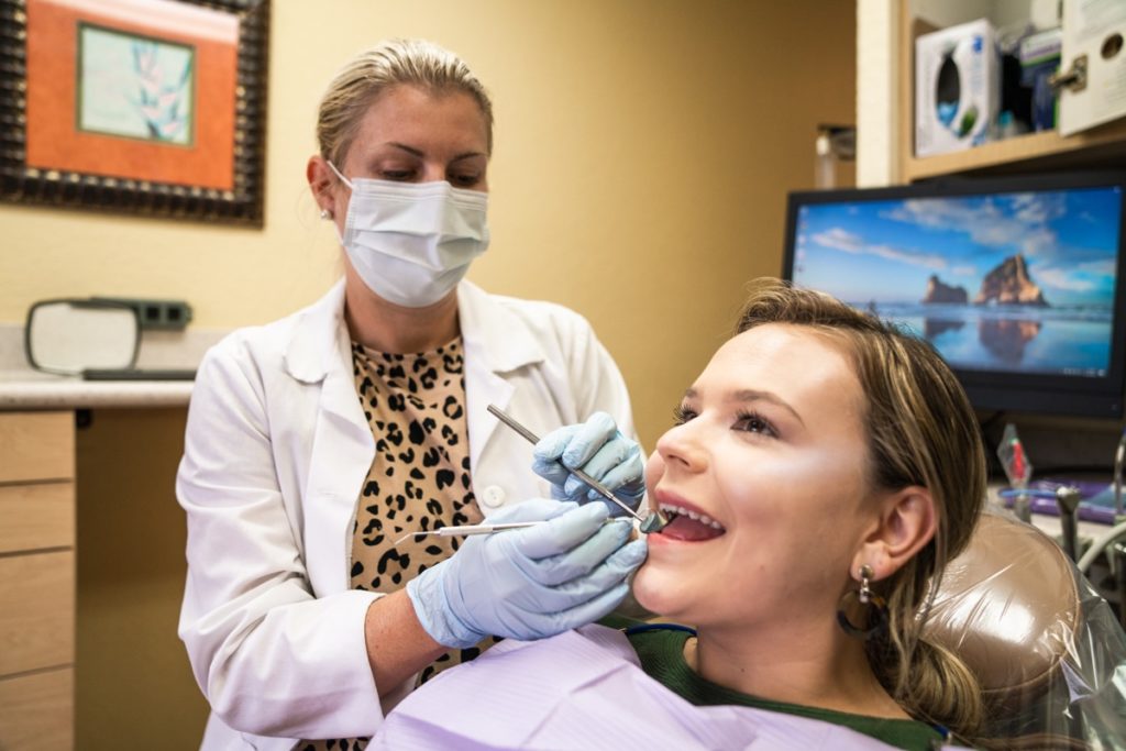 a dentist operating on a patient