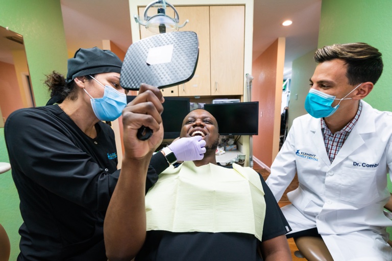 a patient getting their teeth examined