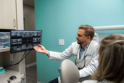 Dentist and patient looking at monitor